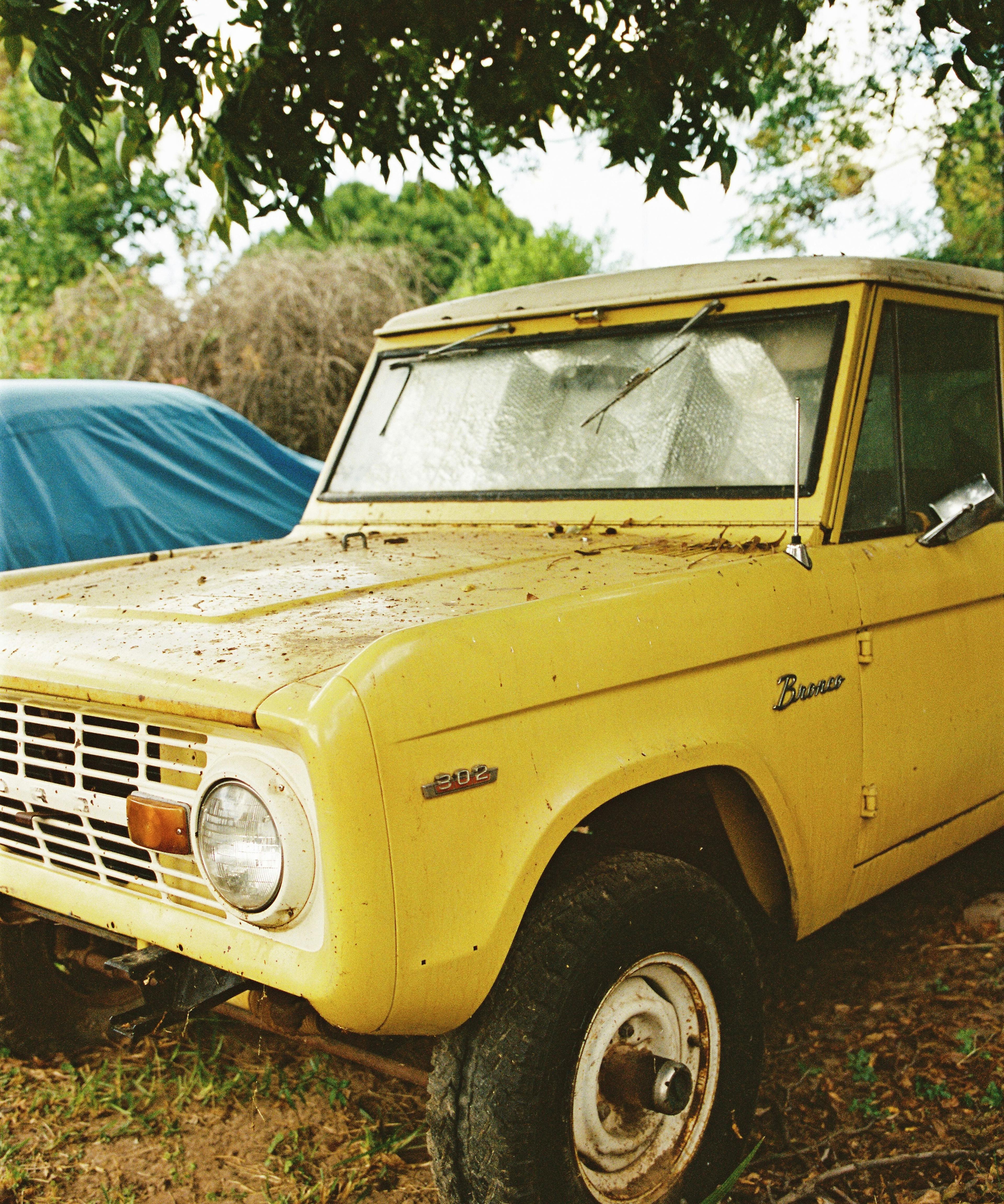 Vintage yellow Bronco captured on film by Natalie Carrasco